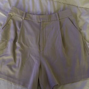 Elegant beige Women's slack shorts.